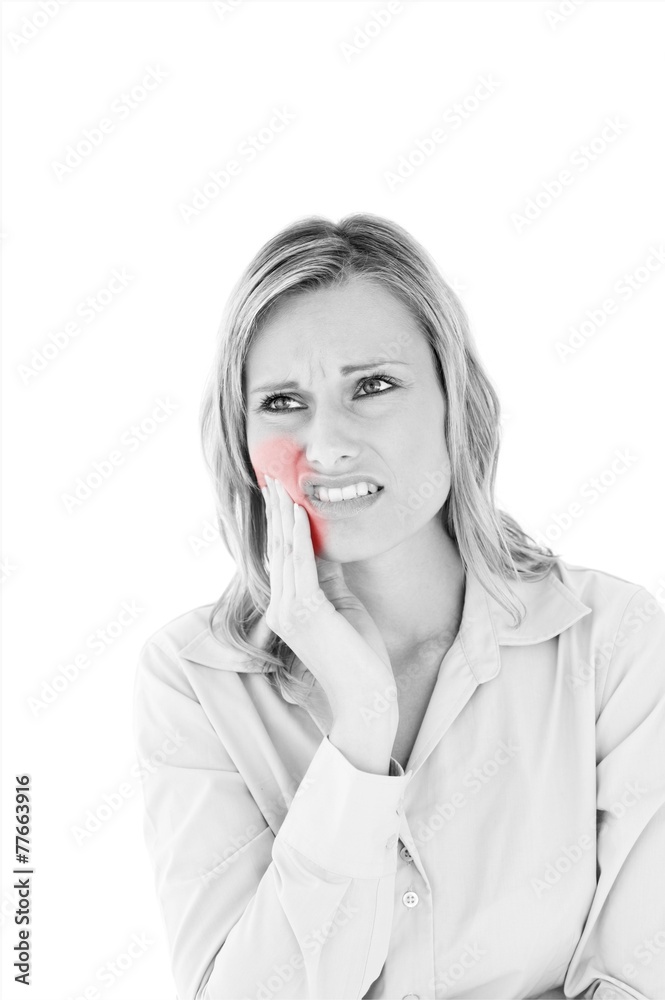 Dejected businesswoman with toothache
