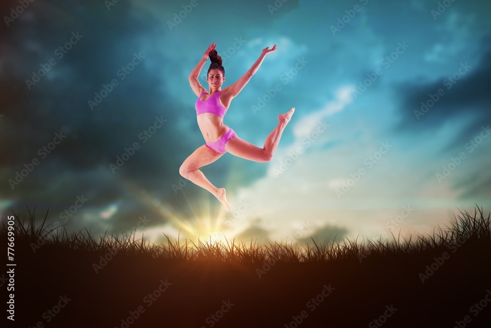 Composite image of fit brunette jumping and posing Composite image of fit brunette jumping and posing