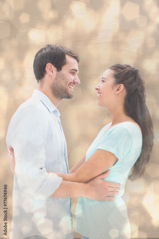Composite image of attractive young couple hugging each other Composite image of attractive young couple hugging each other