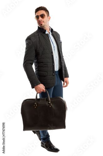 Male model posing as a business man ready for travelling