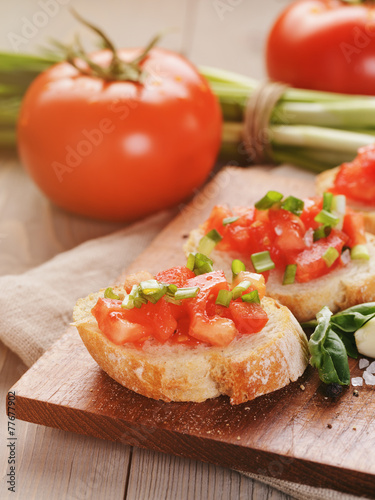 simple italian appetizing bruschetta with tomato and basil, on