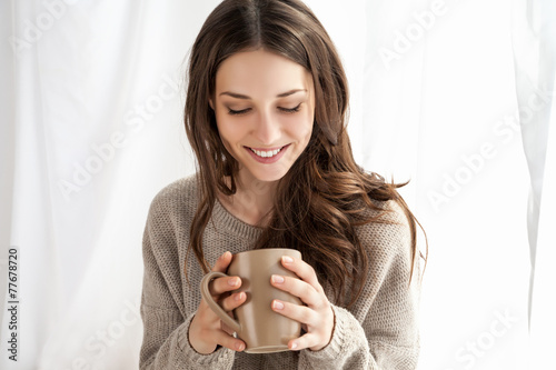 beautiful woman enjoying coffee in the morning