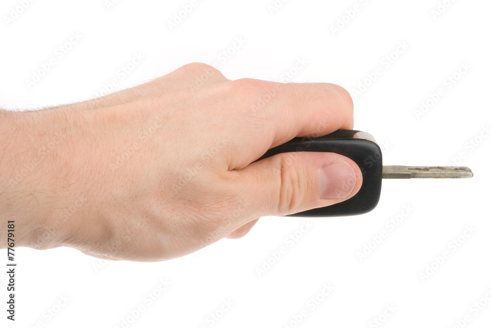 Hand holding car keys isolated on white background Hand holding car keys isolated on white background