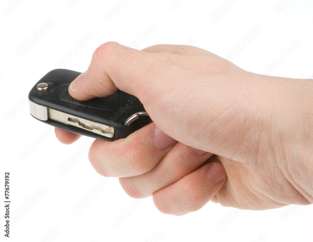 Hand holding car keys isolated on white background Hand holding car keys isolated on white background