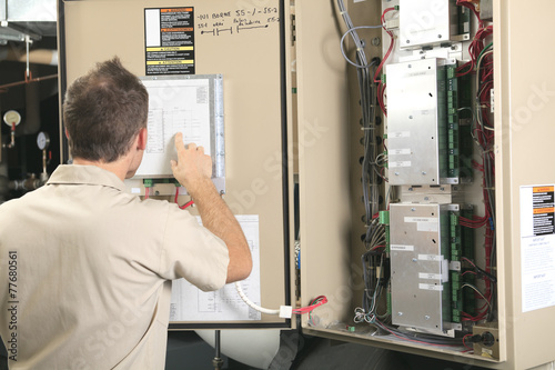 A Air Conditioner Repair Man at work photo