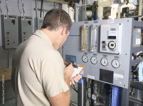 A Air Conditioner Repair Man at work photo