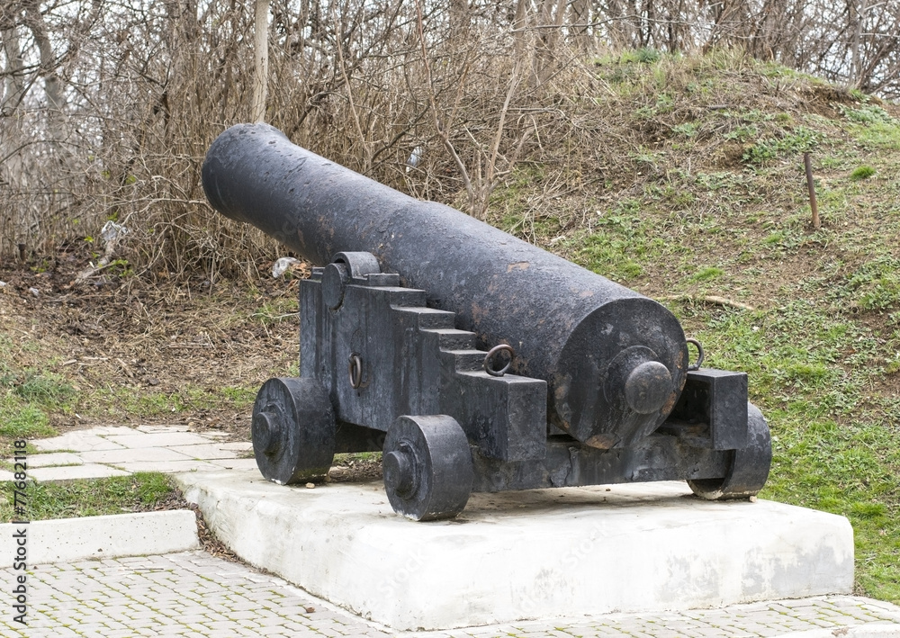 Old ship gun on a coastal position Old ship gun on a coastal position