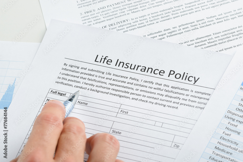 Person Filling Application For Life Insurance Person Filling Application For Life Insurance