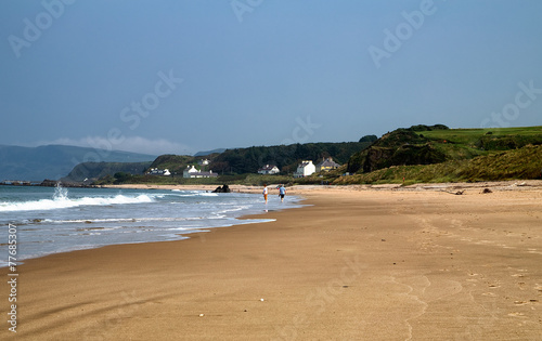 Couple strolling on Ballycastle Beach, Co. Antrim