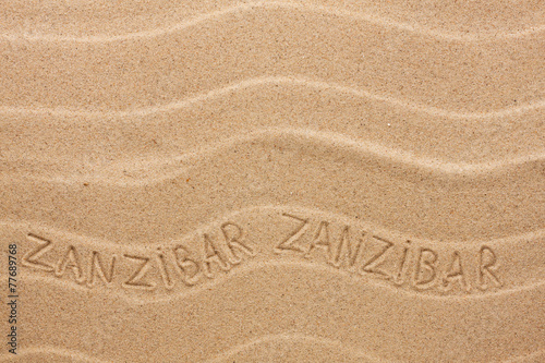 Zanzibar  inscription on the wavy sand