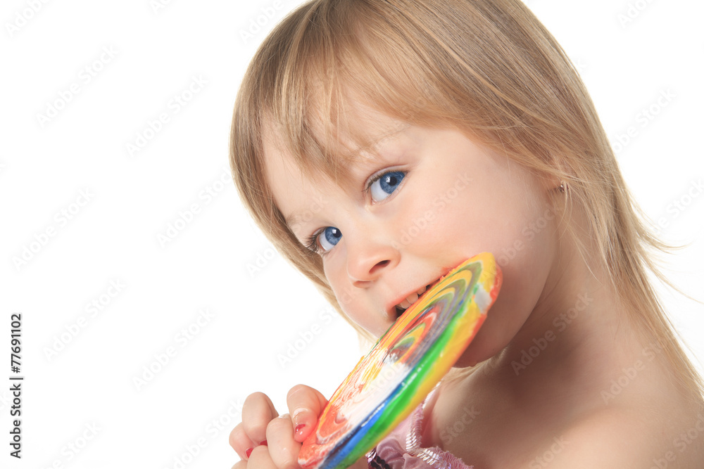 Beautiful little girl holding a big lollipop Beautiful little girl holding a big lollipop
