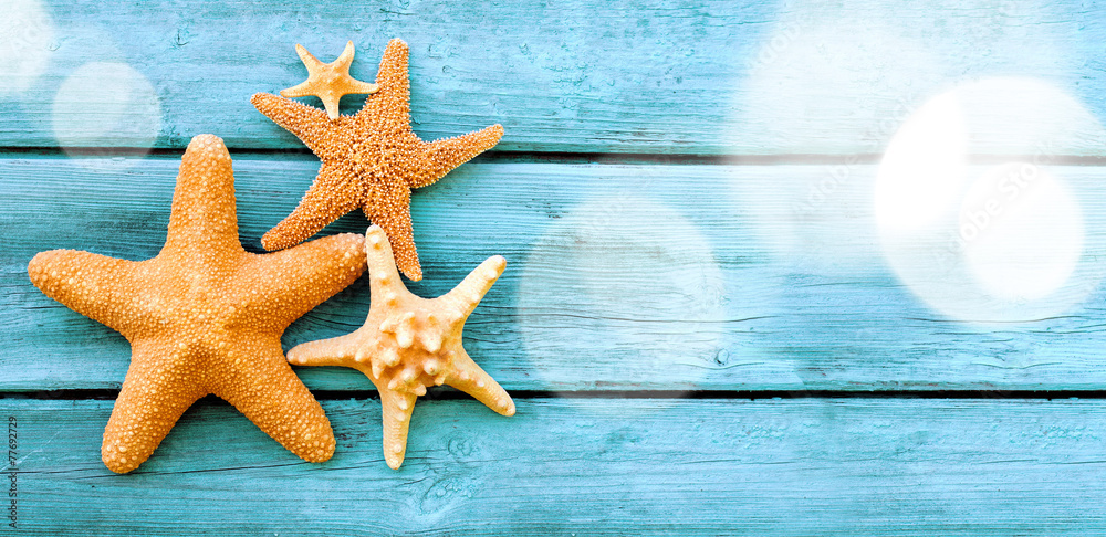 Beach. Starfish on blue wooden deck. Beach. Starfish on blue wooden deck.