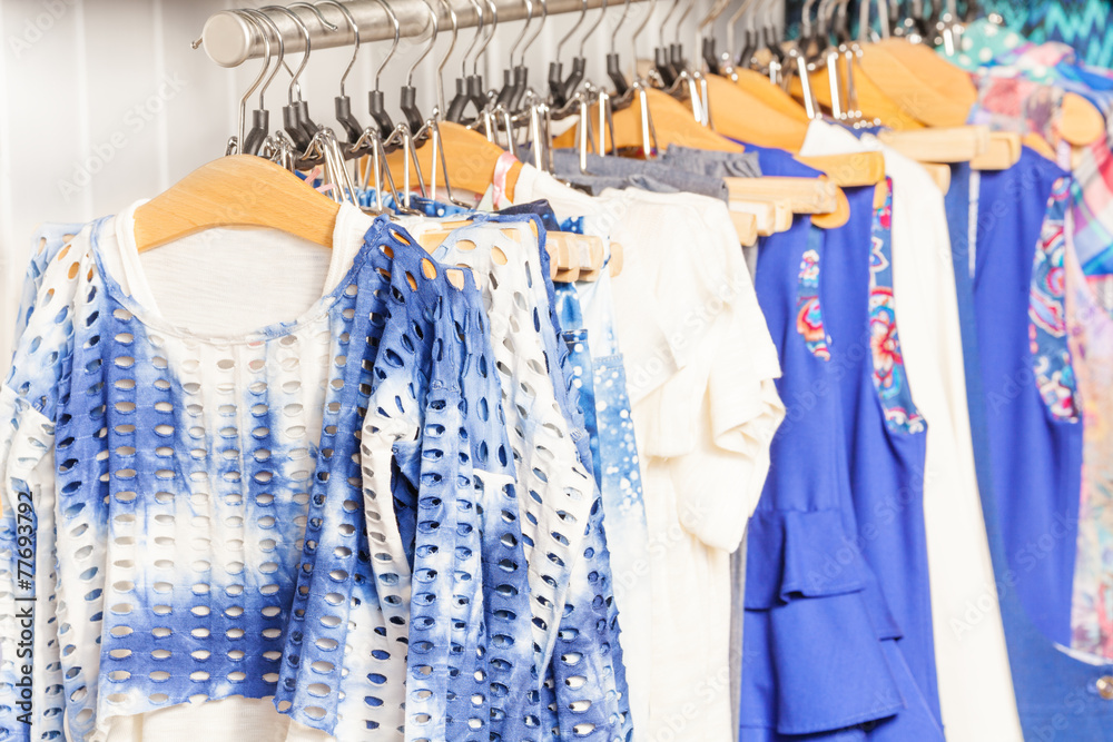 Fashionable blue and white clothes in the shop