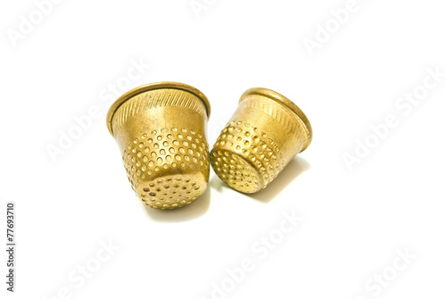 two metal thimbles