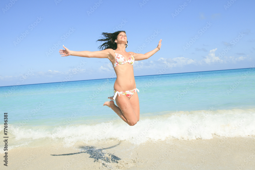 A beautiful woman on a tropical beach cuba