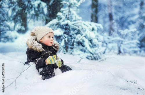 boy in the winter forest
