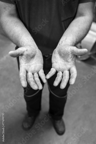 Human hands working on the production. Mechanic powertrain. 34 y