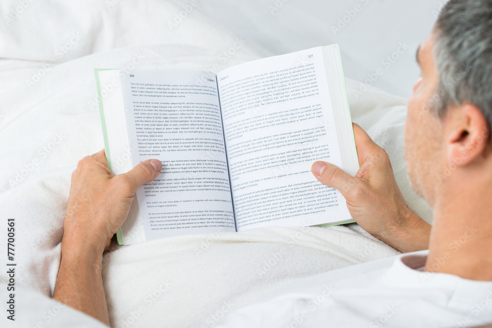 Naklejka premium Mature Man Reading Book