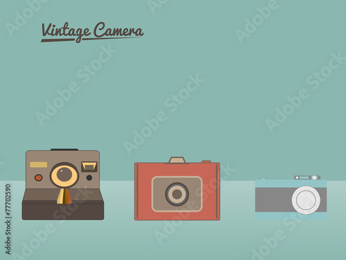 Group of vintage cameras against pastel background