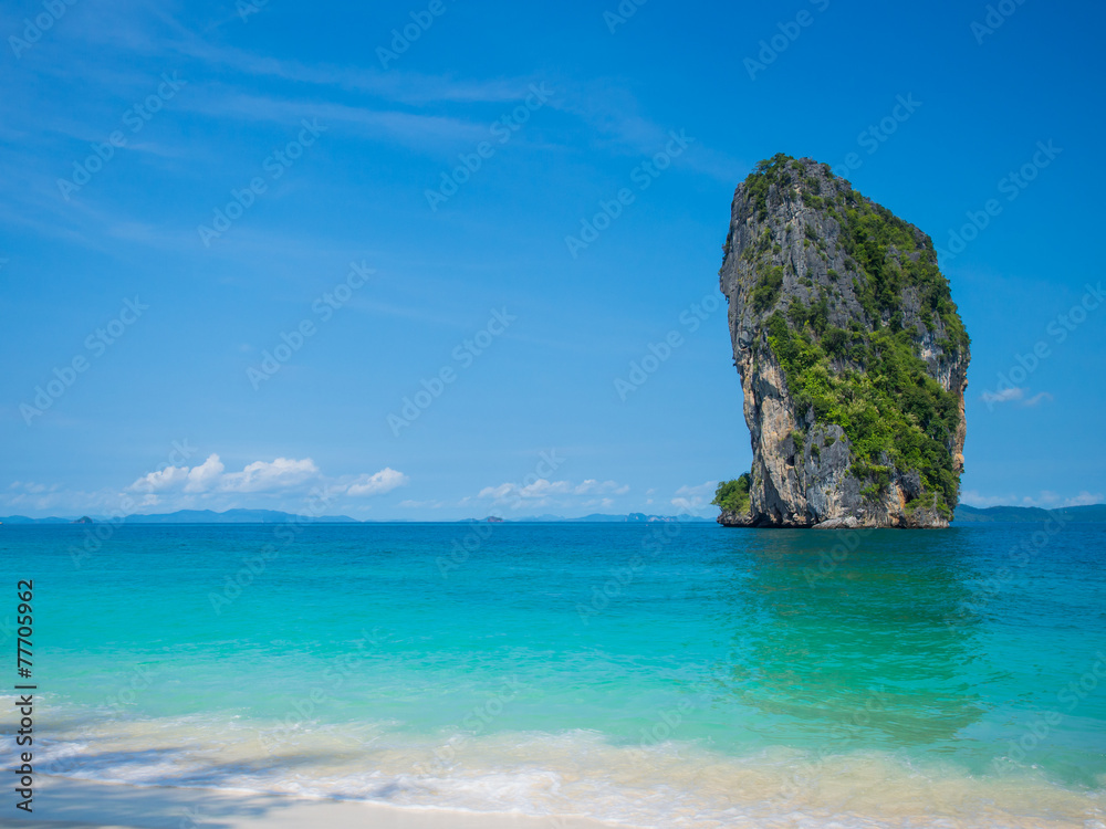 Clear water and blue sky. Beach in Krabi province.