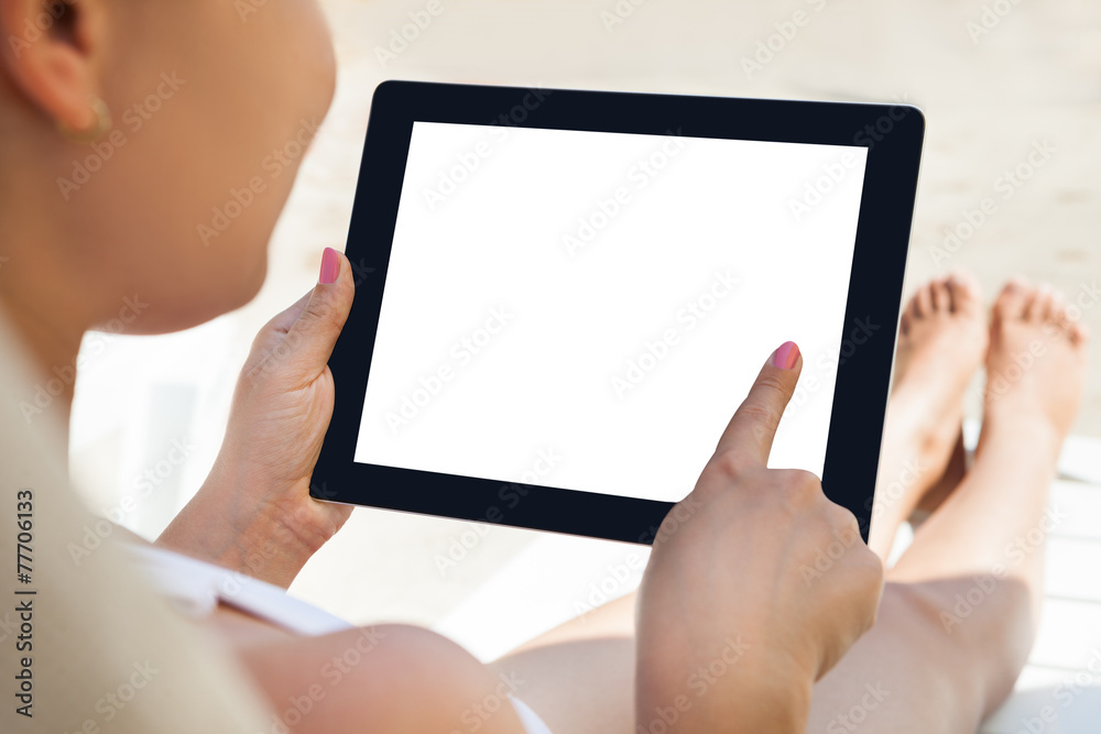 Woman Using Digital Tablet At Resort Woman Using Digital Tablet At Resort