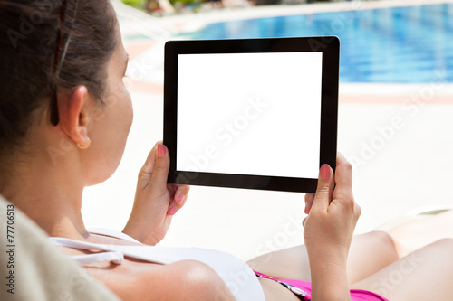 Woman Using Digital Tablet At Resort