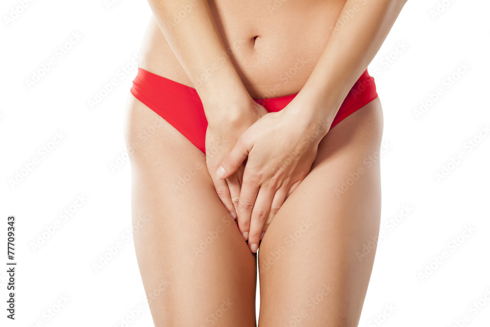 woman in red panties holding her crotch Stock Photo