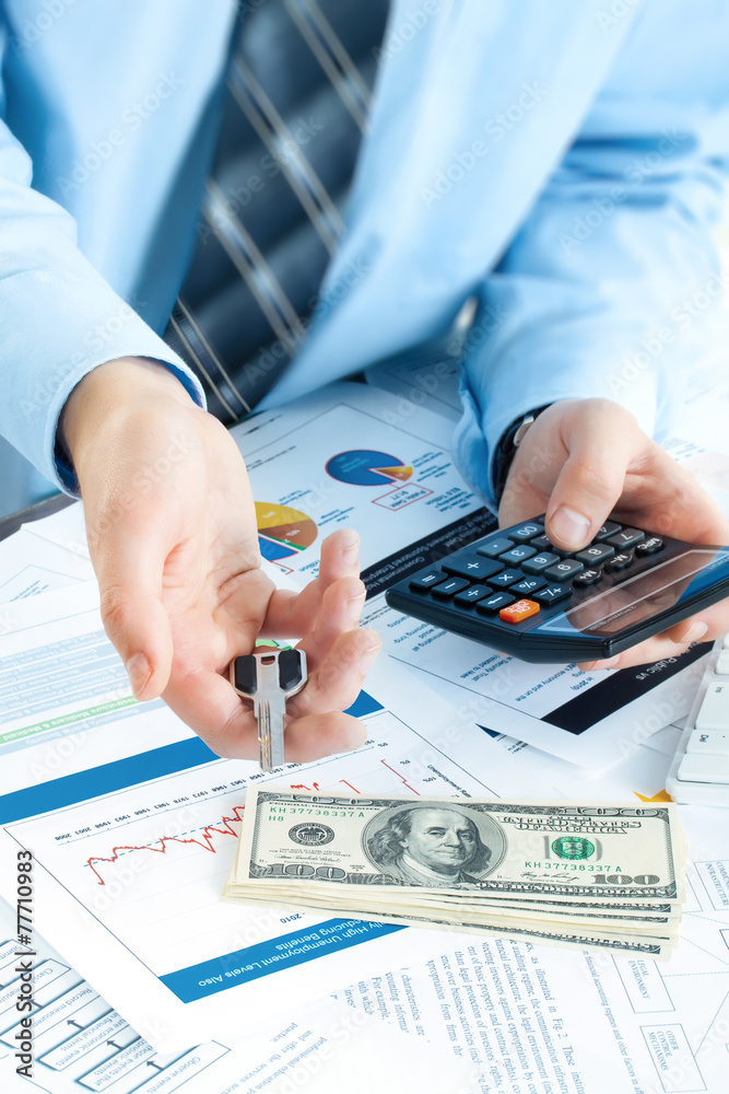 young business man giving key and account money young business man giving key and account money