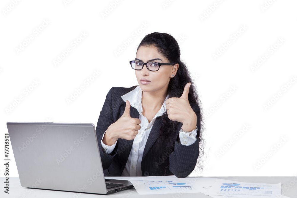 Young indian employee with thumbs up Young indian employee with thumbs up