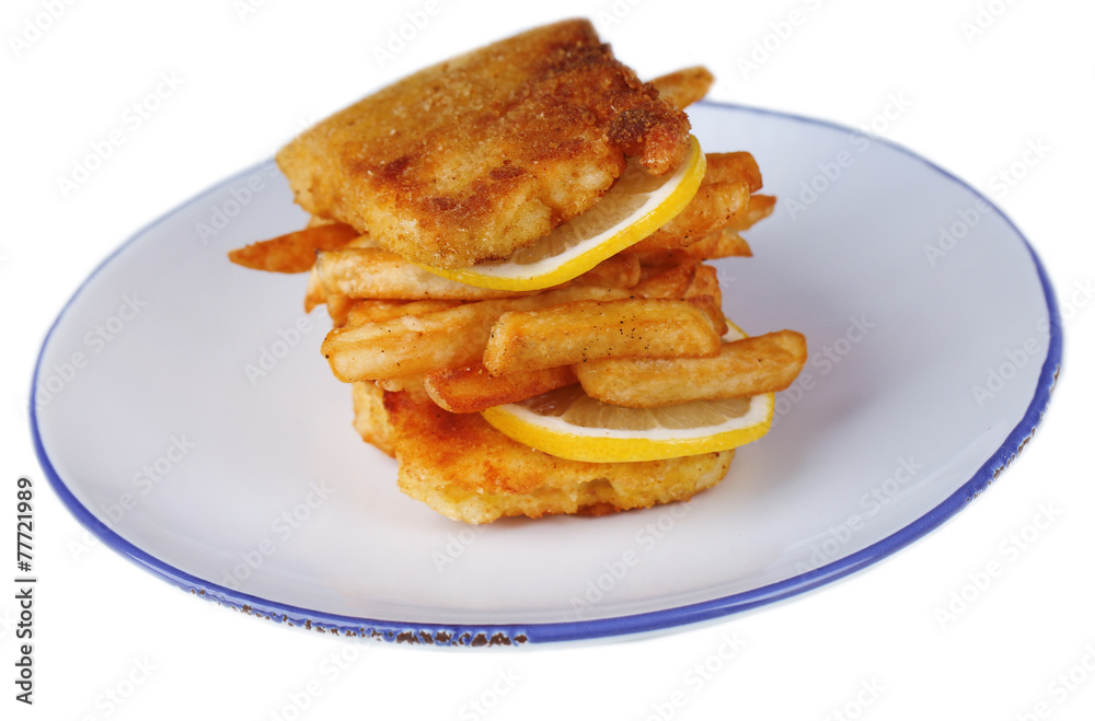 Breaded fried fish fillet and potatoes with sliced lemon Breaded fried fish fillet and potatoes with sliced lemon
