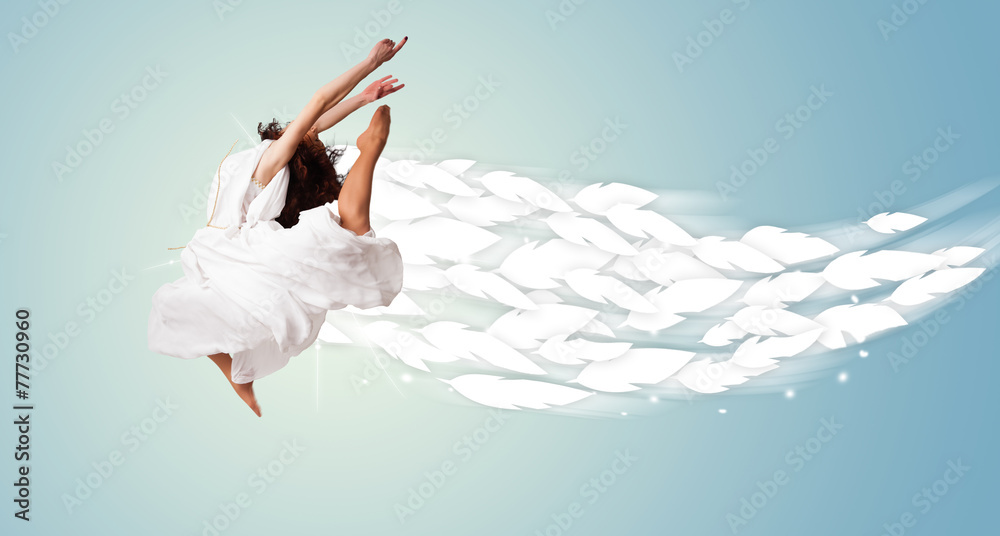 Healthy young woman jumping with feathers around her Healthy young woman jumping with feathers around her