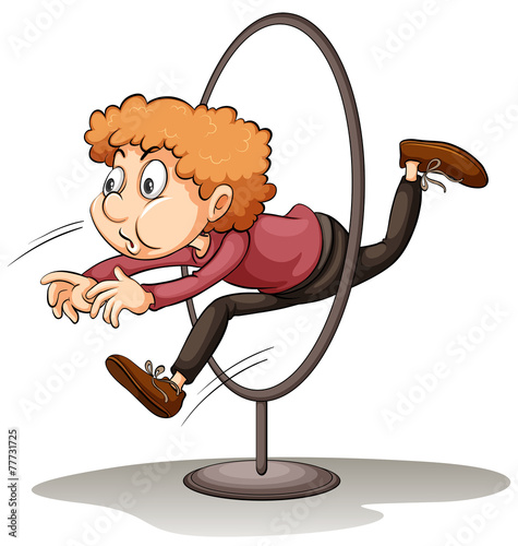 A man jumping through a hoop