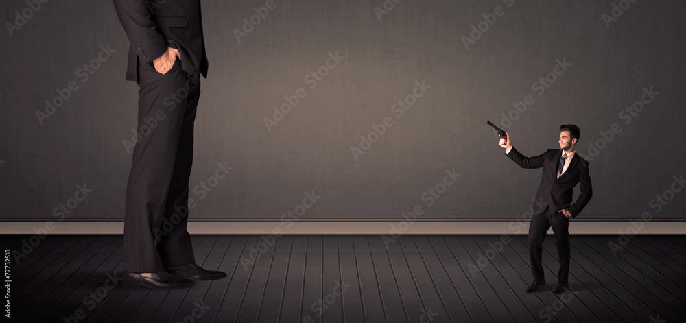 Obraz premium Little bussinesman in front of a giant boss legs concept