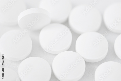 abstract background - a scattering of white tablets