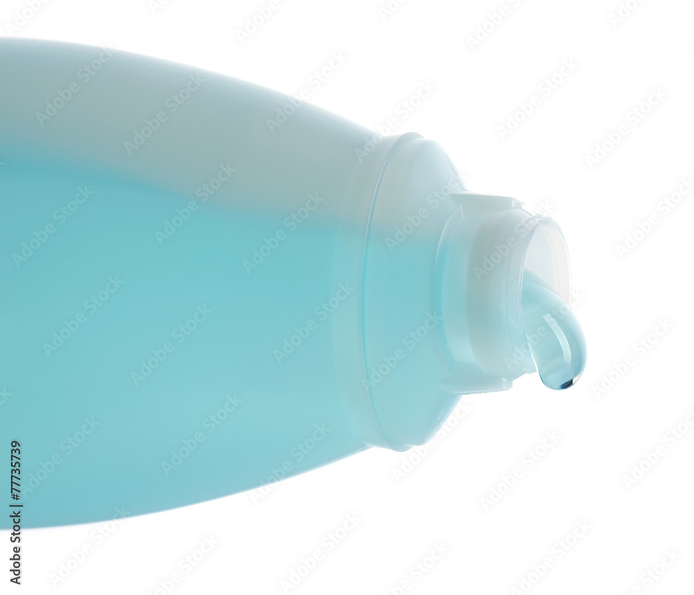 Cosmetic liquid pouring from bottle isolated on white Cosmetic liquid pouring from bottle isolated on white