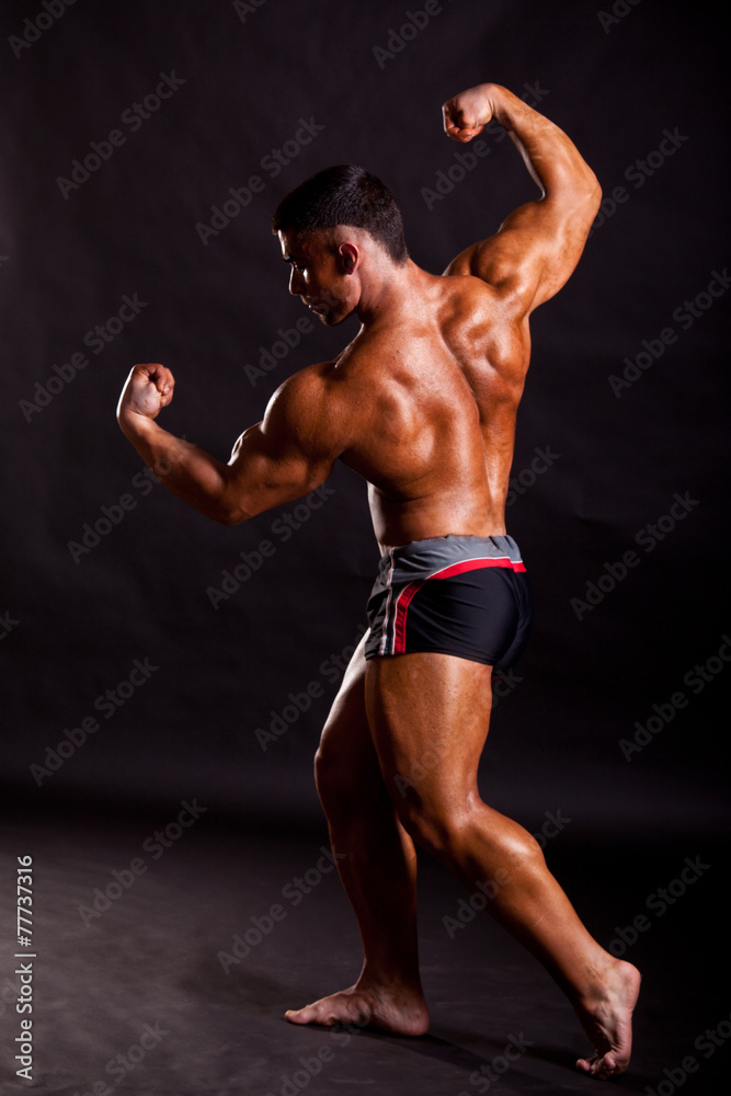Naklejka premium young bodybuilder posing