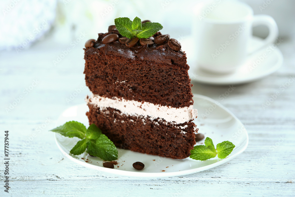 Delicious chocolate cake on table on light background Delicious chocolate cake on table on light background