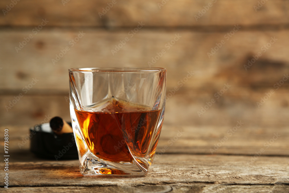 Whiskey on wooden background Whiskey on wooden background