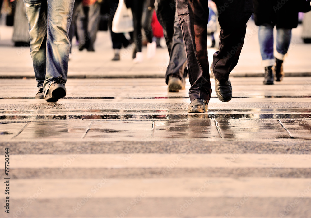 Pedestrians on zebra crossing after the rain Pedestrians on zebra crossing after the rain