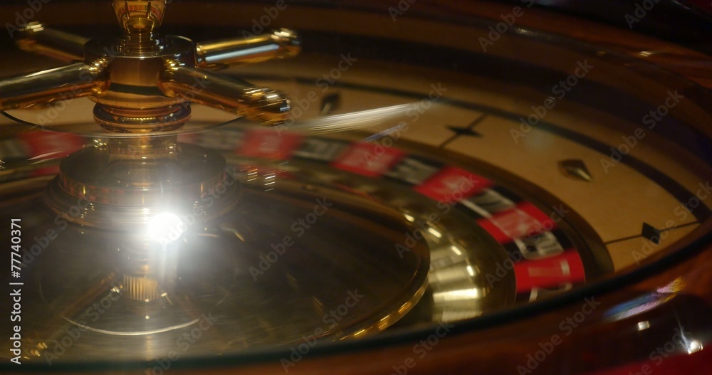 Close up shot of a casino roulette in motion Close up shot of a casino roulette in motion
