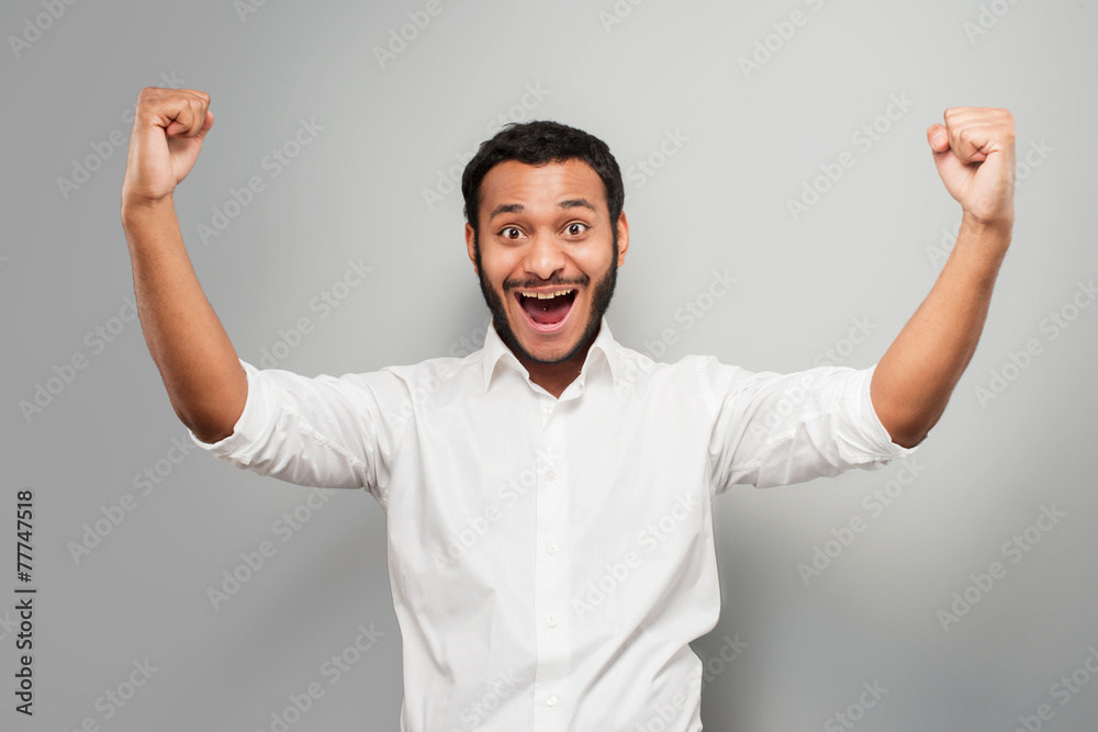 Fototapeta premium Young mixed race man cheerfully smiling