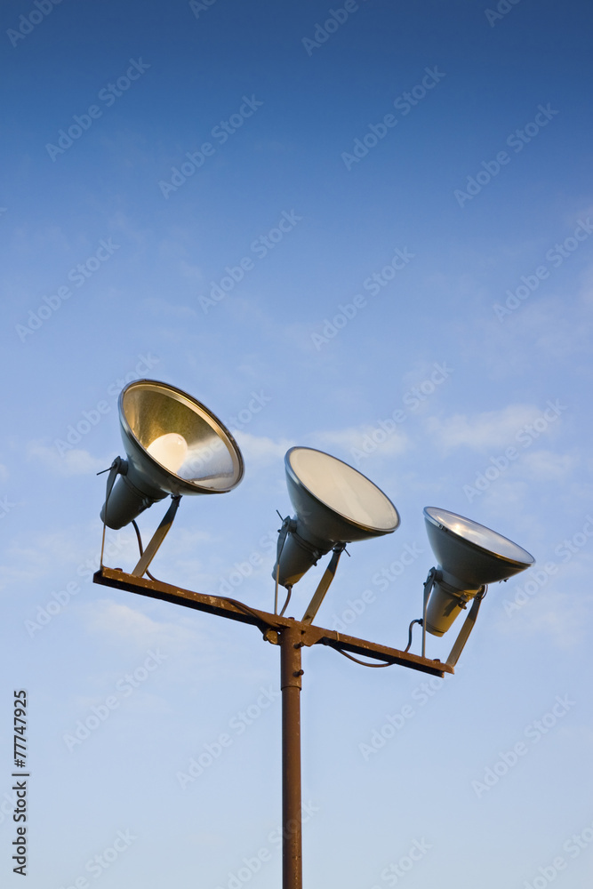 Three projectors of light against the sky background Three projectors of light against the sky background