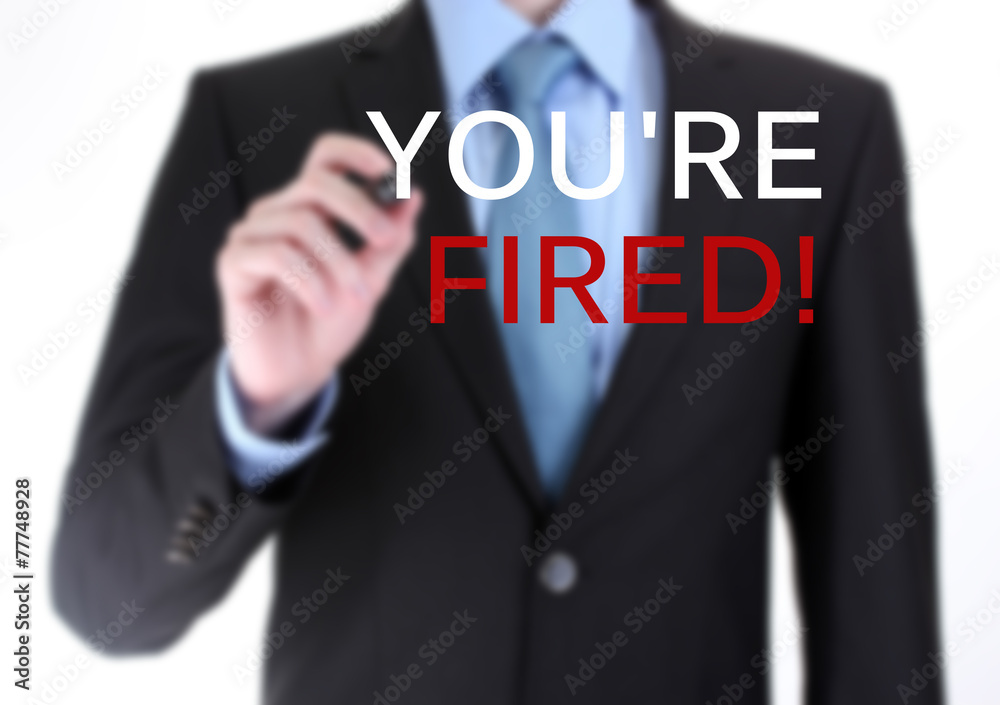 Businessman writing You're fired on screen isolated on white Businessman writing You're fired on screen isolated on white