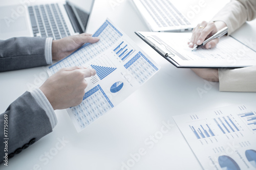 Business people discussing the charts and graphs showing the res