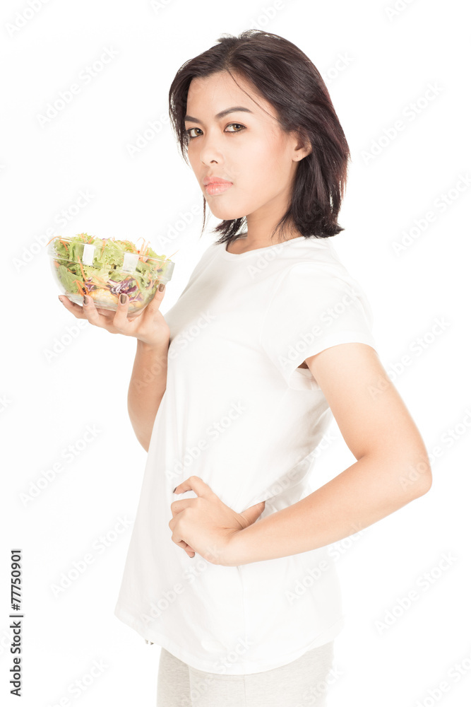 Pretty girl eating fresh vegetable salad Pretty girl eating fresh vegetable salad