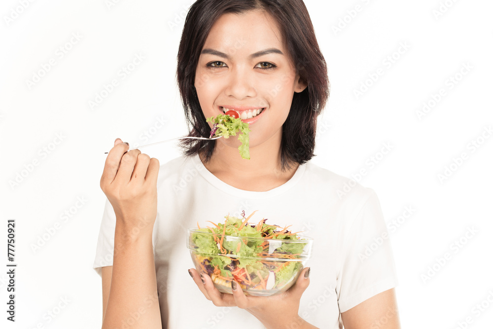 Pretty girl eating fresh vegetable salad Pretty girl eating fresh vegetable salad