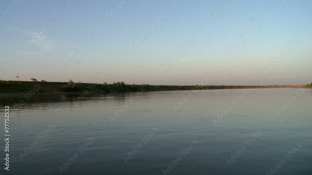 Top view of river shore during sunset Top view of river shore during sunset