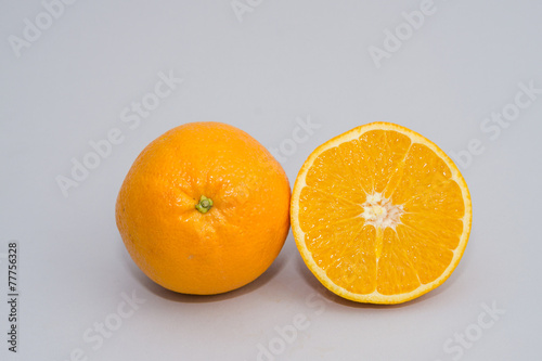 sliced orange isolated on light gray