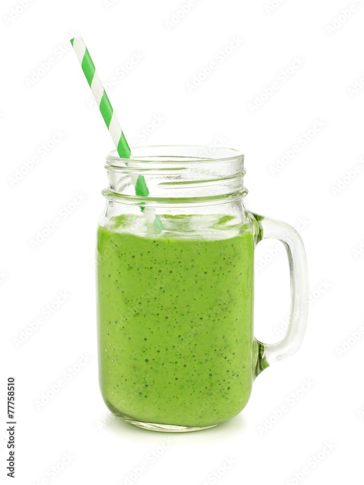 Healthy green smoothie with straw in a jar mug isolated Healthy green smoothie with straw in a jar mug isolated