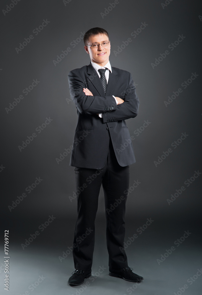 A young and handsome businessman in formal clothes A young and handsome businessman in formal clothes
